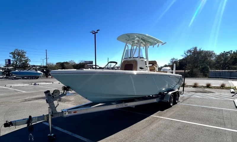 Slide: The Image of 2026 Pathfinder 2400 TRS boat parked on trailer outdoors. - 7