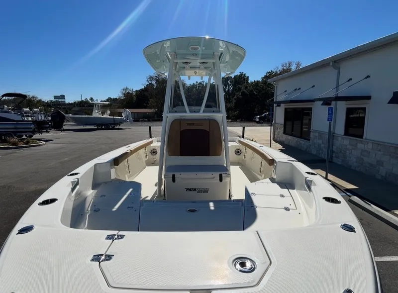 Slide: The Image of 2026 Pathfinder 2400 TRS boat on a sunny parking lot. - 9