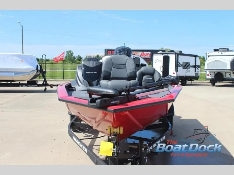 Slide: The Image of Red 2026 Pro Team 175 TXW boat on trailer outdoors. - 4