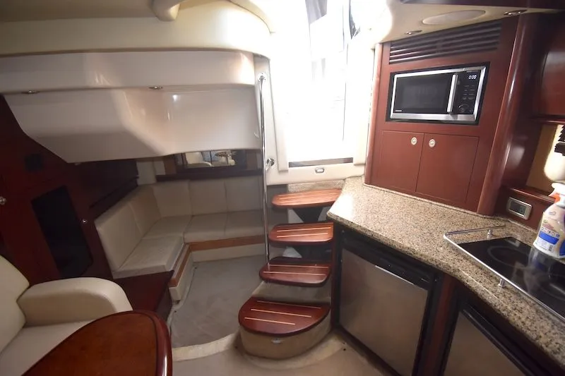 Slide: The Image of Interior of 2007 Sea Ray 40 Sundancer with kitchen and seating area. - 10