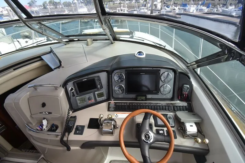 Slide: The Image of 2007 Sea Ray 40 Sundancer cockpit with controls and instruments. - 13