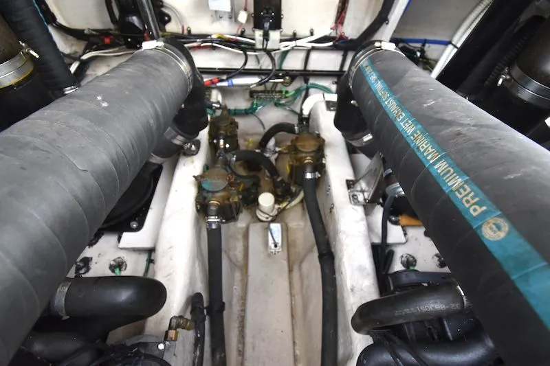 Slide: The Image of Engine room of 2007 Sea Ray 40 Sundancer with hoses and cables. - 21