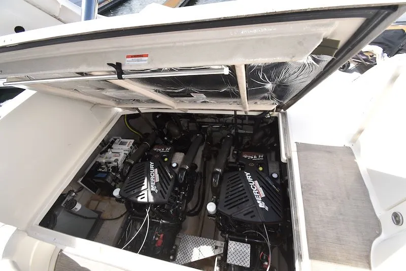 Slide: The Image of Engine compartment of a 2007 Sea Ray 40 Sundancer with Mercury engines. - 23