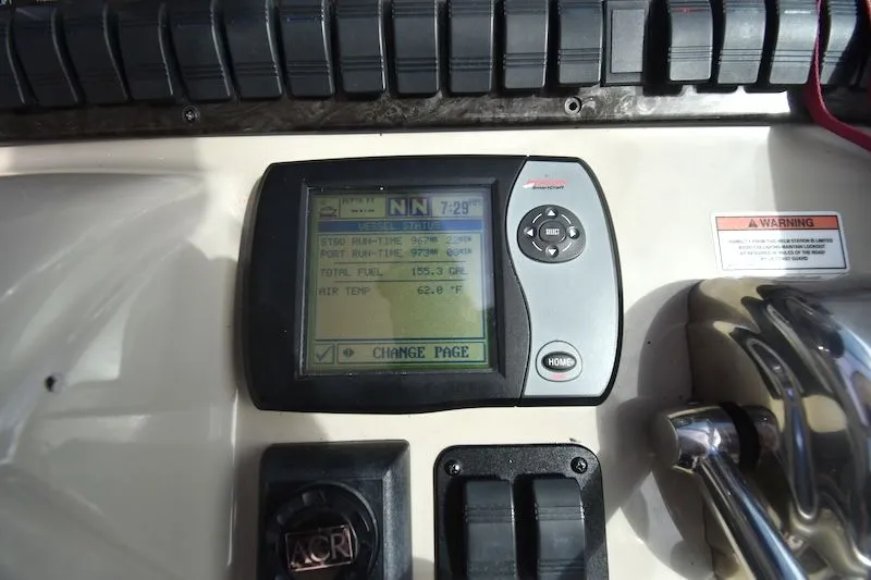 Slide: The Image of 2007 Sea Ray 40 Sundancer dashboard with display and controls. - 26