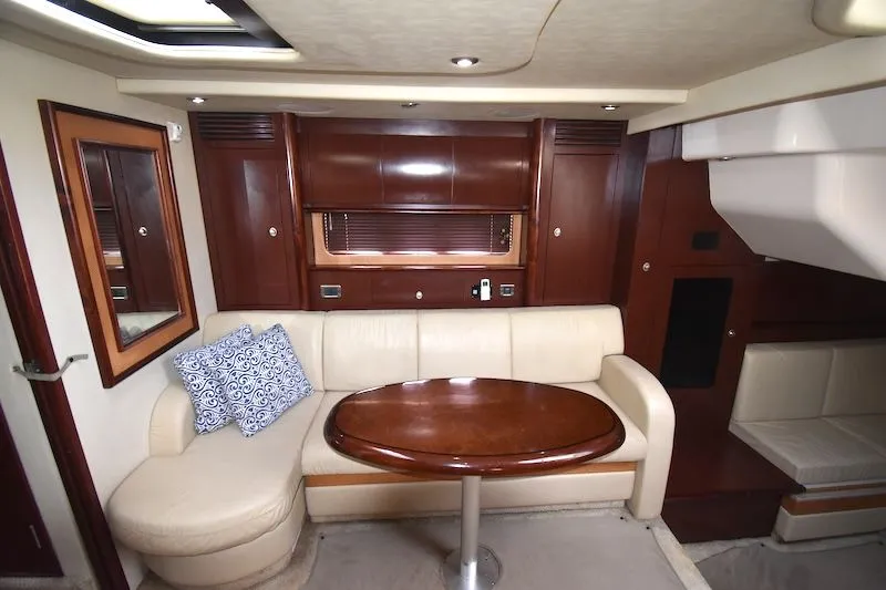 Slide: The Image of Interior of 2007 Sea Ray 40 Sundancer with leather sofa and wooden table. - 6