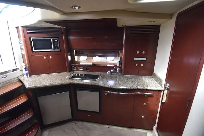 Slide: The Image of Interior of 2007 Sea Ray 40 Sundancer with modern kitchen. - 9