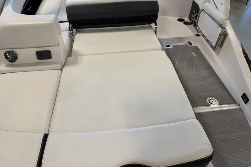 Slide: The Image of 2016 Regal 2550 Cuddy boat interior with cushioned seating and sleek design. - 15