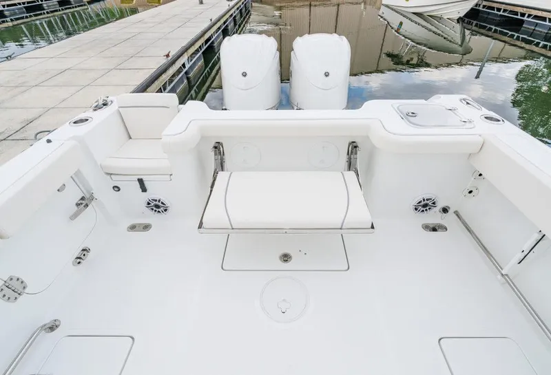 Slide: The Image of Manufacturer Provided Image: 2026 Sea Hunt Gamefish 27 boat interior with forward seating, docked at marina. - 13