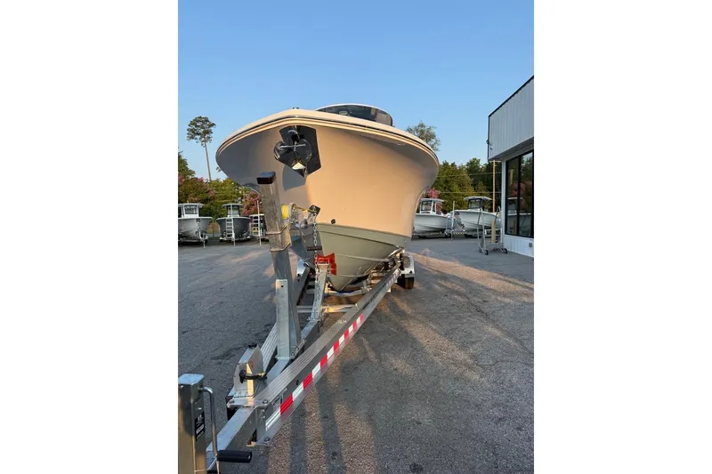 Slide: The Image of 2026 Sea Hunt Gamefish 27 Forward Seating boat on trailer in outdoor setting. - 16