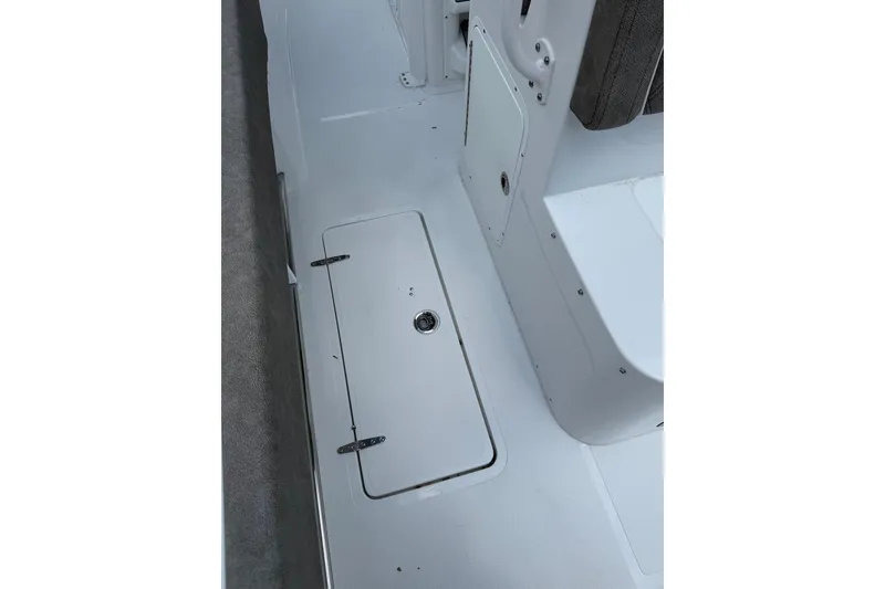 Slide: The Image of 2026 Sea Hunt Gamefish 27 Forward Seating deck with storage compartment. - 21