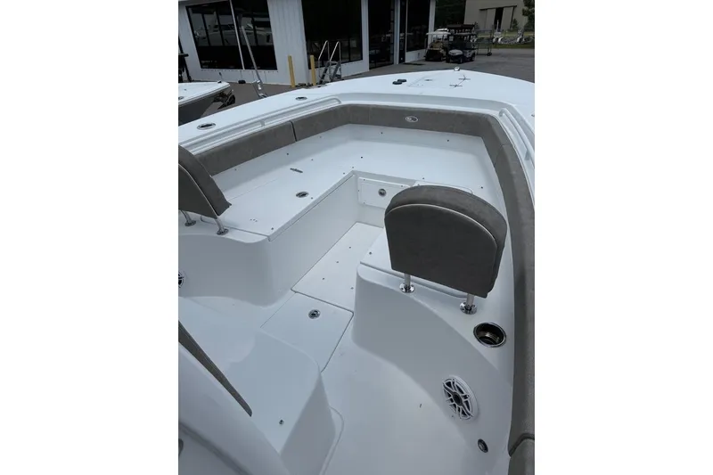 Slide: The Image of 2026 Sea Hunt Gamefish 27 Forward Seating boat interior with cushioned seats and storage compartments. - 24