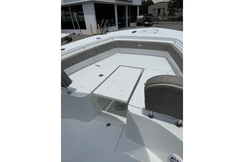 Slide: The Image of 2026 Sea Hunt Gamefish 27 Forward Seating boat interior with spacious seating and table. - 26