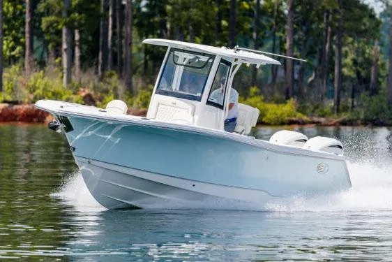 Slide: The Image of Manufacturer Provided Image: 2026 Sea Hunt Gamefish 27 Forward Seating boat cruising on a calm lake. - 7