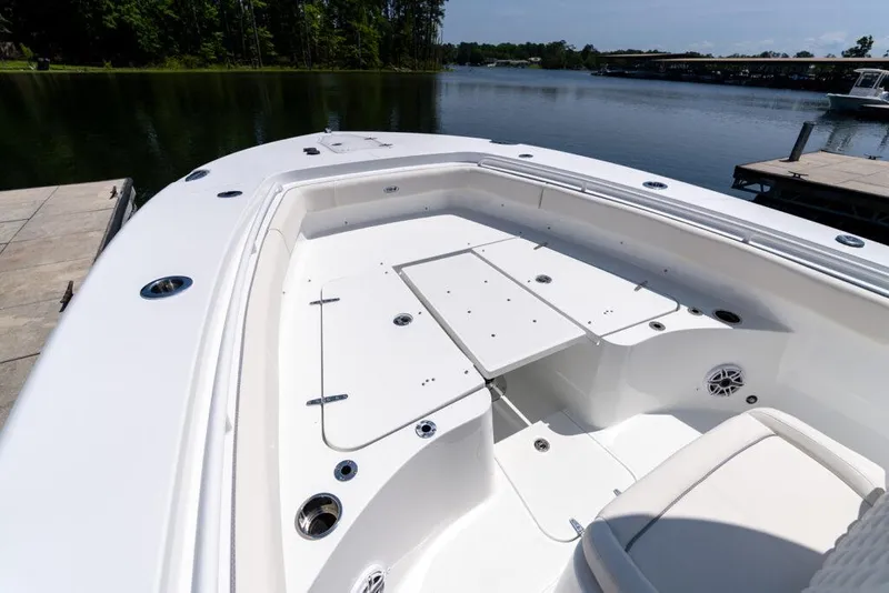 Slide: The Image of Manufacturer Provided Image: 2026 Sea Hunt Gamefish 27 boat with forward seating, docked by a serene lake. - 8