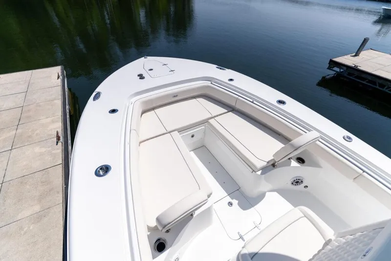 Slide: The Image of Manufacturer Provided Image: 2026 Sea Hunt Gamefish 27 boat with forward seating, docked on calm water. - 9