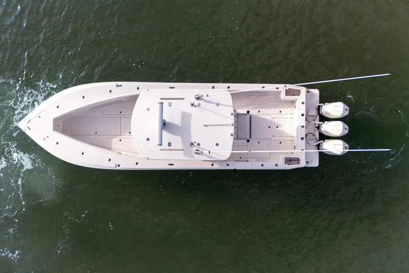Slide: The Image of Top view of 2022 SeaVee 370Z boat with triple engines on water. - 17