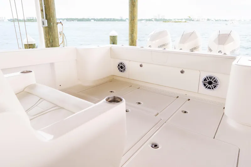 Slide: The Image of 2022 SeaVee 370Z boat interior with seating, speakers, and Mercury engines in the background. - 20