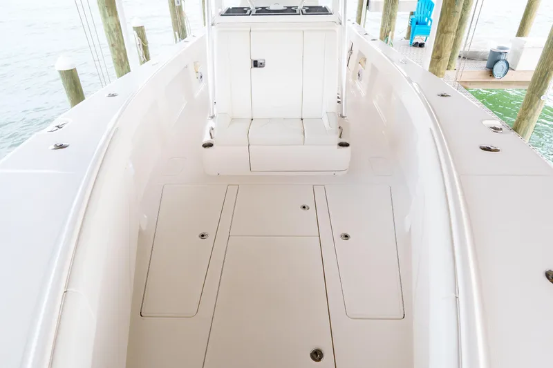 Slide: The Image of 2022 SeaVee 370Z boat deck with storage compartments and seating. - 21