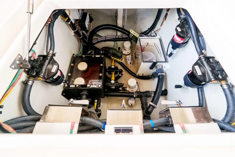 Slide: The Image of Engine compartment of 2022 SeaVee 370Z boat, showcasing intricate mechanical components and wiring. - 28