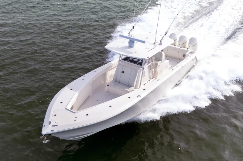Slide: The Image of 2022 SeaVee 370Z boat cruising on open water, showcasing sleek design and powerful engines. - 3