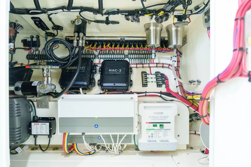 Slide: The Image of Electrical system of a 2022 SeaVee 370Z boat, featuring wiring and control units. - 36