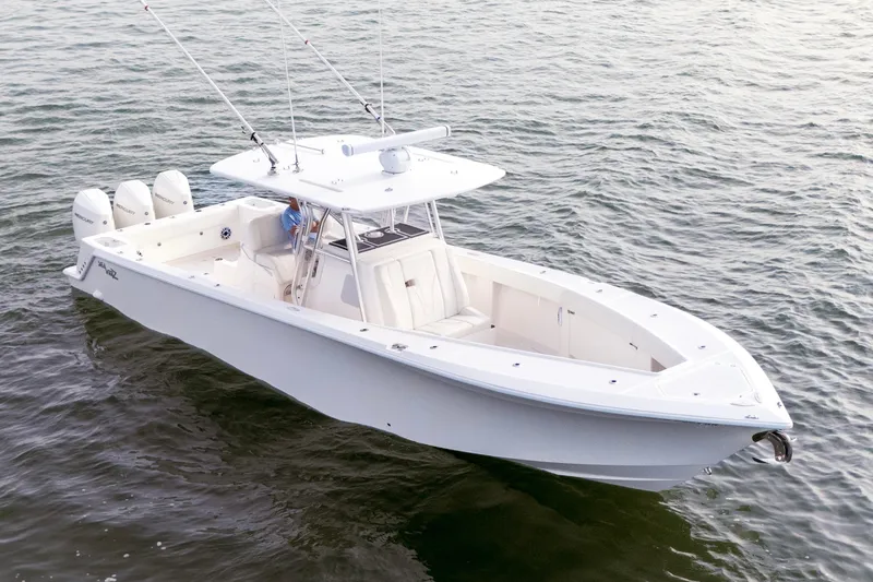 Slide: The Image of 2022 SeaVee 370Z boat on water, featuring triple outboard engines. - 4