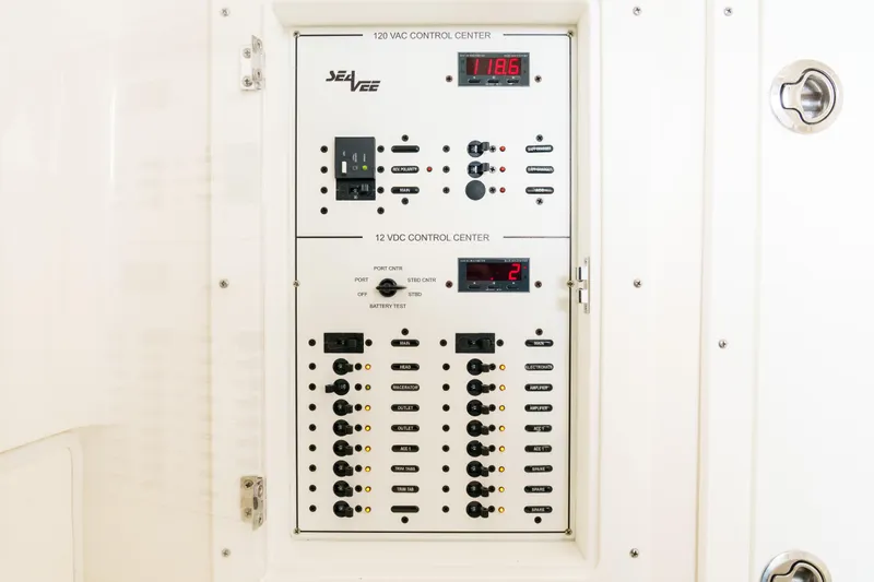 Slide: The Image of Electrical control panel of 2022 SeaVee 370Z boat, featuring 120 VAC and 12 VDC systems. - 40