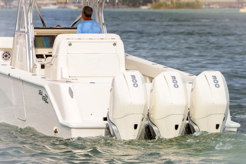 Slide: The Image of 2022 SeaVee 370Z boat with triple Mercury outboard engines on the water. - 9