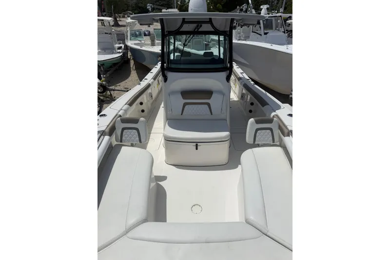 Slide: The Image of 2020 World Cat 325 CC boat interior with spacious seating and modern design. - 13