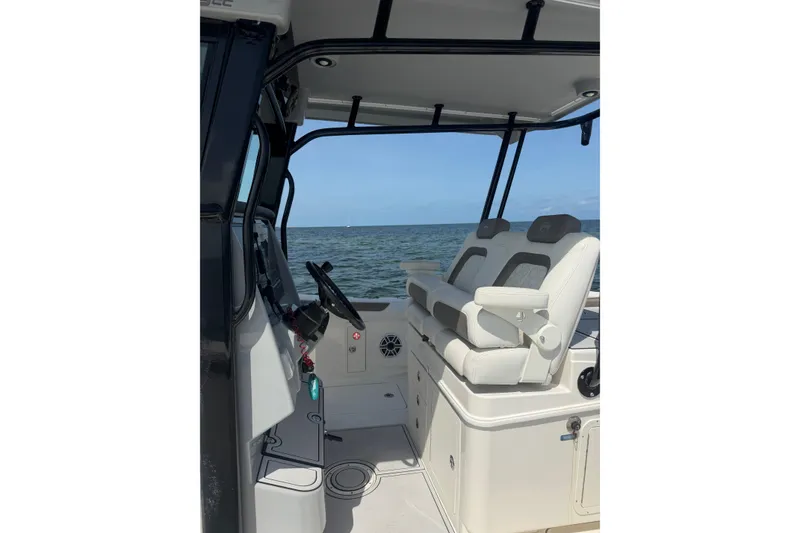 Slide: The Image of 2020 World Cat 325 CC boat interior with dual seats and ocean view. - 18