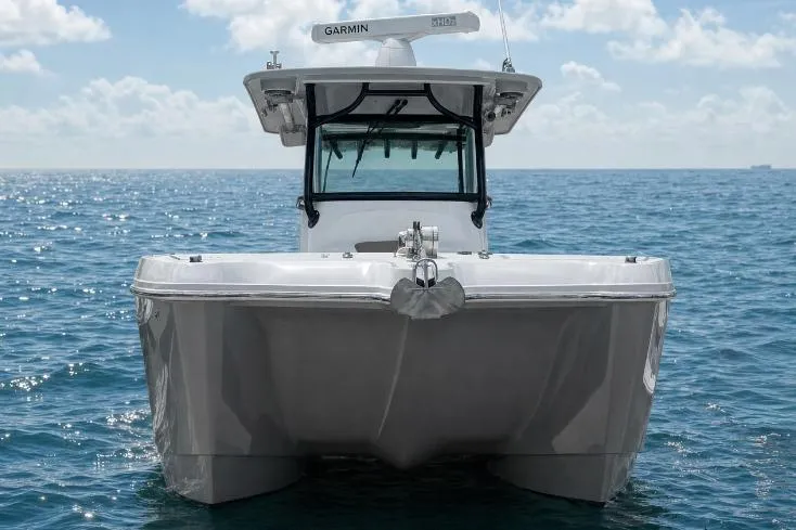 Slide: The Image of 2020 World Cat 325 CC boat on open sea under clear sky. - 2