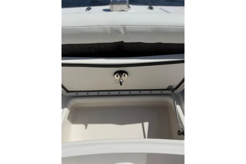 Slide: The Image of Open storage compartment on 2020 World Cat 325 CC boat. - 23