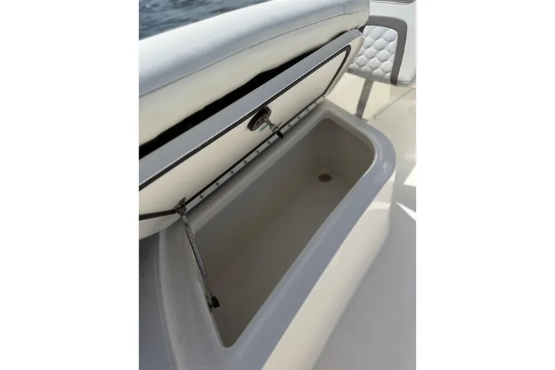 Slide: The Image of Open storage compartment on a 2020 World Cat 325 CC boat. - 24