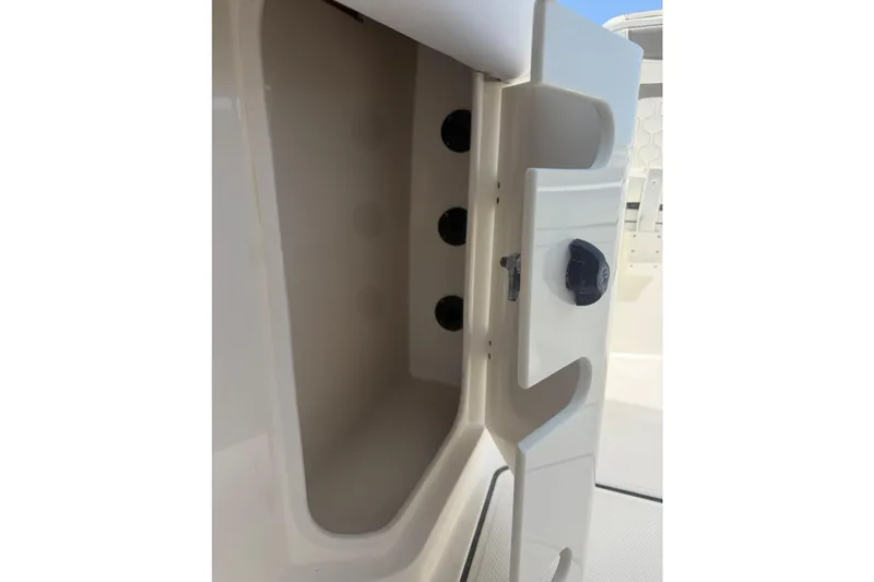 Slide: The Image of Open storage compartment on a 2020 World Cat 325 CC boat, showcasing interior space. - 26