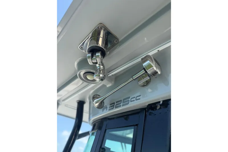 Slide: The Image of 2020 World Cat 325 CC boat detail with stainless steel fixtures and logo. - 29