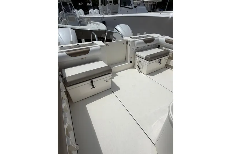 Slide: The Image of 2020 World Cat 325 CC boat interior with seating and storage compartments. - 6