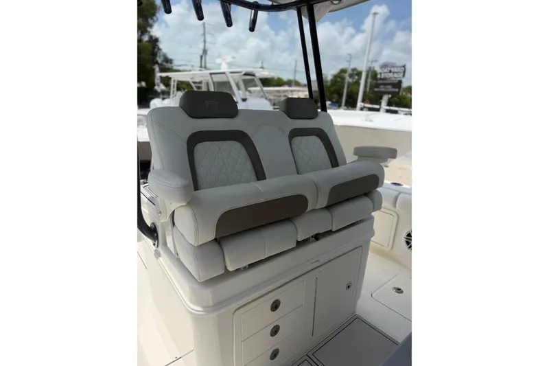 Slide: The Image of Luxury seating on 2020 World Cat 325 CC boat, featuring plush, dual captain's chairs. - 9