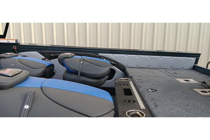 Slide: The Image of Interior of 2025 Ranger VX1788 WT boat with blue and black seating. - 15