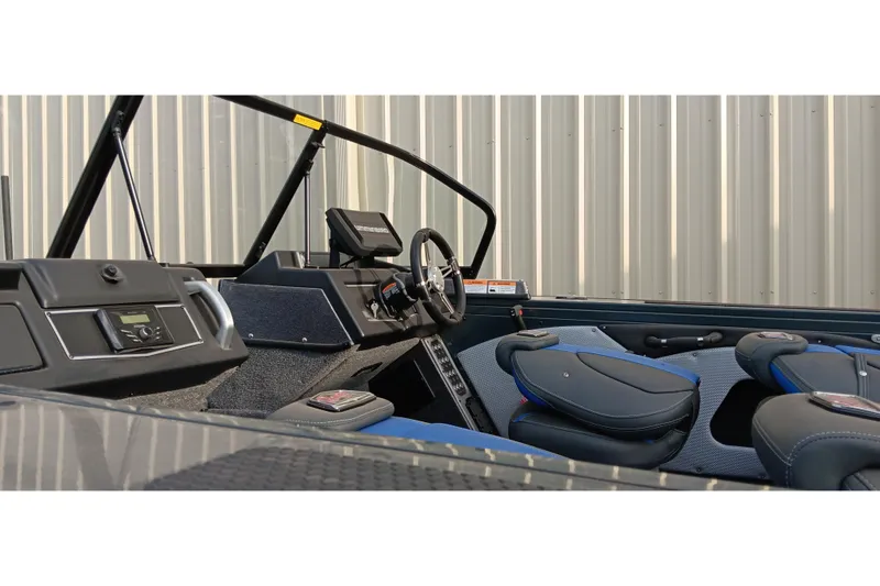 Slide: The Image of 2025 Ranger VX1788 WT boat interior with steering wheel and seating. - 18