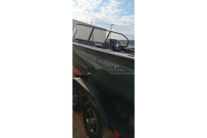 Slide: The Image of 2025 Ranger VX1788 WT boat on trailer under a cloudy sky. - 4