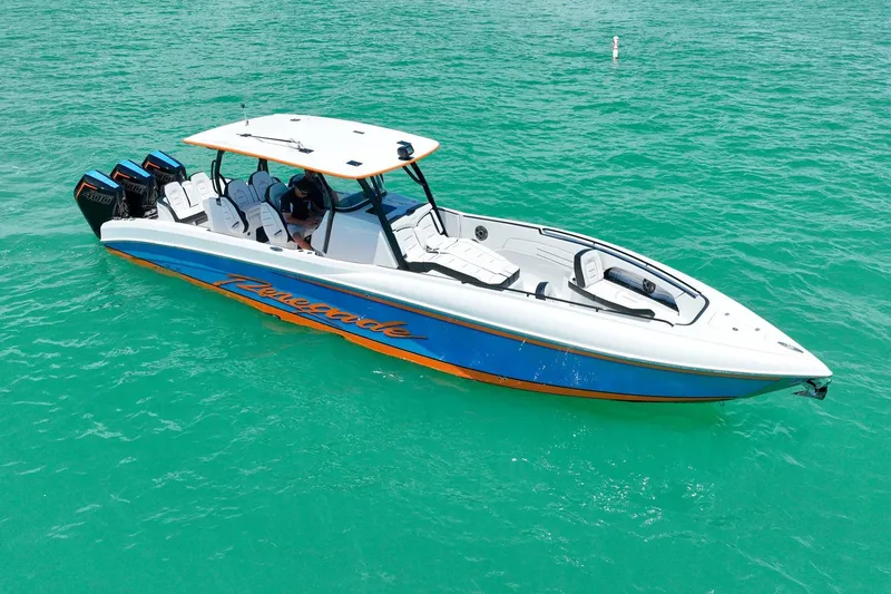 The Image of 2027 Renegade 38' Open boat on turquoise water, featuring sleek design and powerful engines. - 0