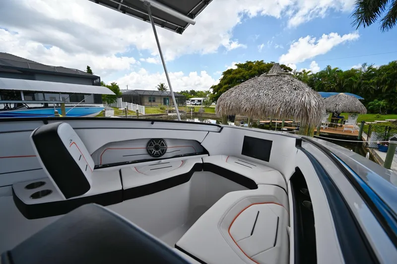 Slide: The Image of Luxurious interior of 2027 Renegade 38' Open boat with modern seating and scenic waterfront view. - 10
