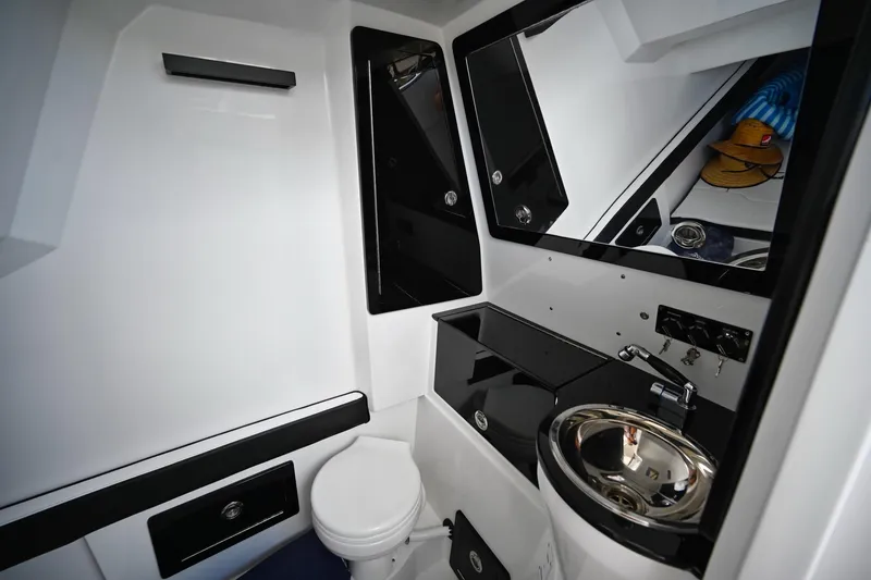 Slide: The Image of Modern bathroom interior of 2027 Renegade 38' Open boat with sleek fixtures. - 13