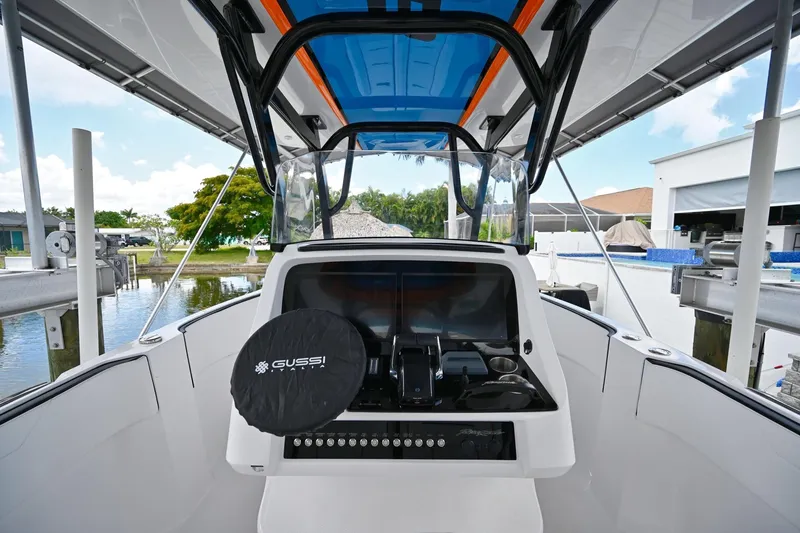 Slide: The Image of 2027 Renegade 38' Open boat cockpit with modern controls and Gussi steering wheel cover. - 20
