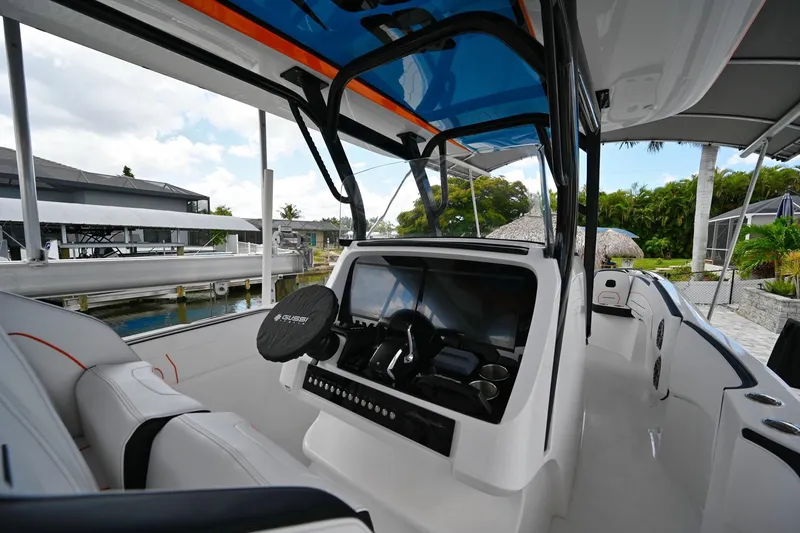 Slide: The Image of Interior view of 2027 Renegade 38' Open boat, showcasing modern helm and seating. - 21