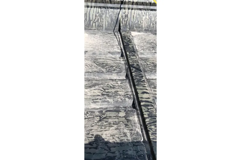 Slide: The Image of Interior view of 2026 Tracker Topper 1542 LW Riveted Jon boat with textured flooring. - 11