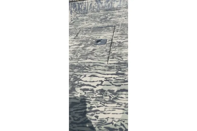 Slide: The Image of Camouflage-patterned surface of 2026 Tracker Topper 1542 LW Riveted Jon boat. - 12