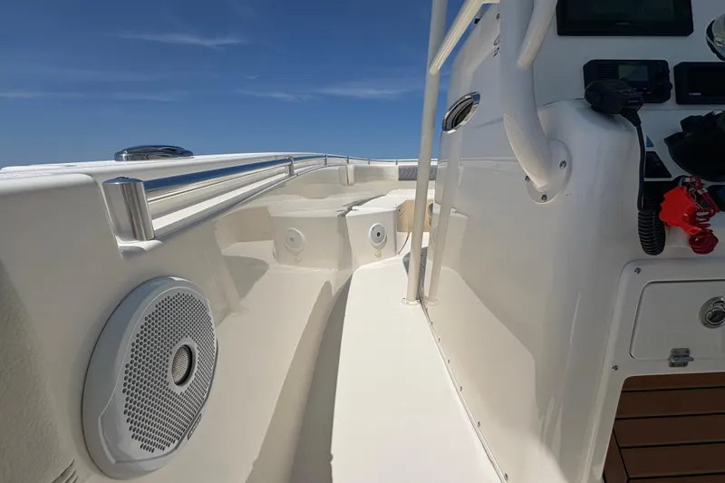 Slide: The Image of 2018 Cobia 277 Center Console boat interior with speaker and control panel. - 15