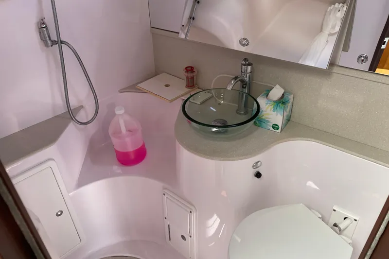 Slide: The Image of Bathroom interior of a 2014 Catalina 355 yacht with modern fixtures and glass sink. - 19