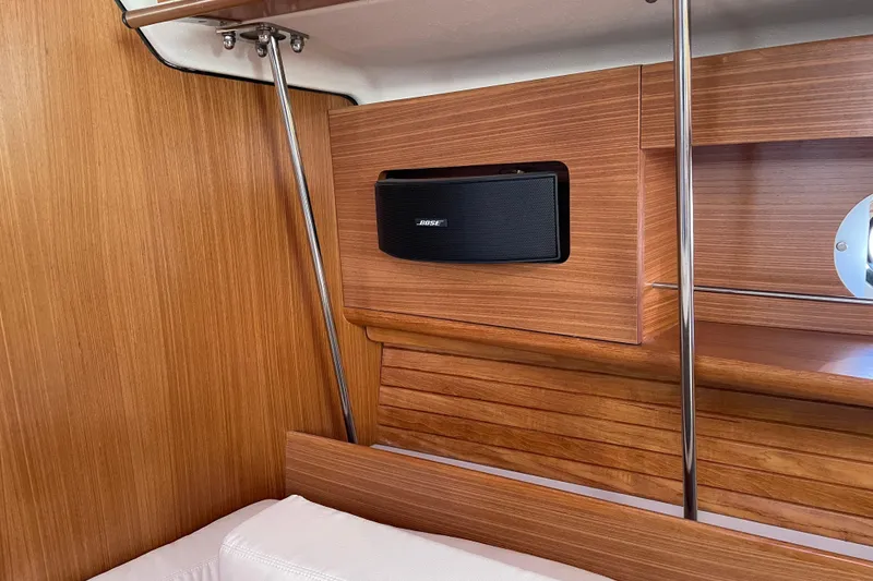 Slide: The Image of Interior of 2014 Catalina 355 yacht with wooden paneling and built-in Bose speaker. - 22